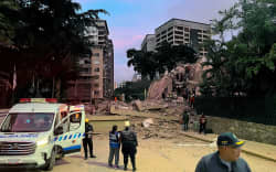 Rescuers search for victims in a collapsed building in Caracas following an earthquake on June 24.
Mandatory Credit:	Manaure Quintero/AFP/Getty Images via CNN Newsource