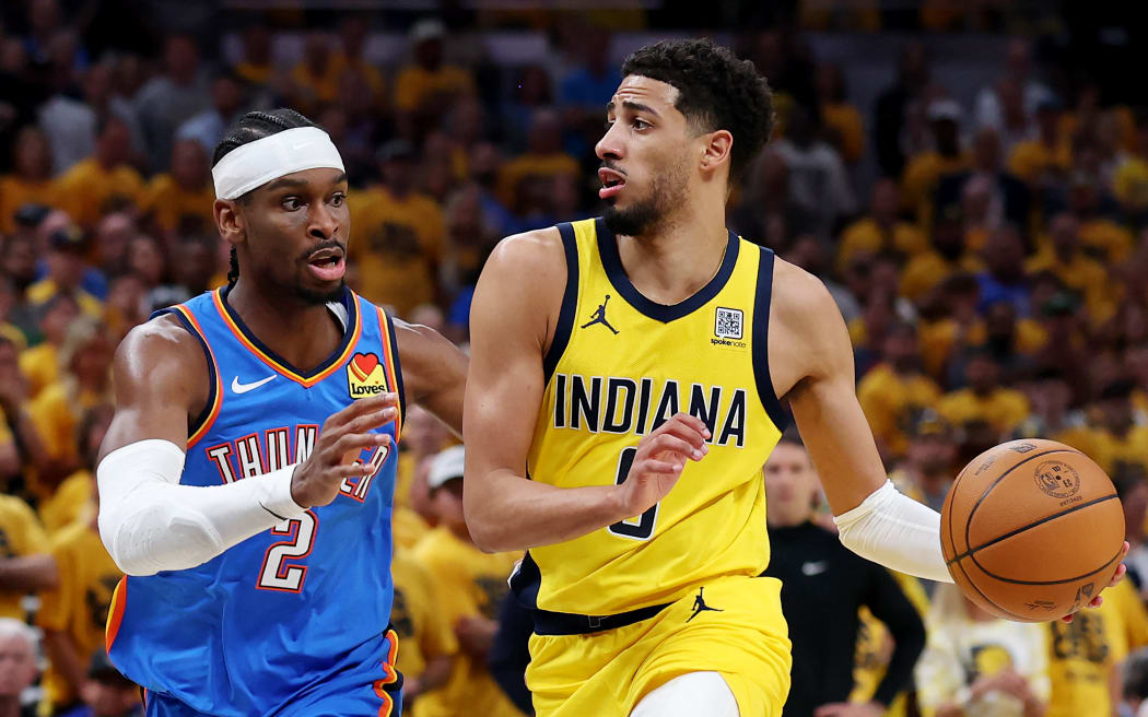 INDIANAPOLIS, INDIANA - JUNE 19: Tyrese Haliburton #0 of the Indiana Pacers drives to the basket against Shai Gilgeous-Alexander #2 of the Oklahoma City Thunder during the second quarter in Game Six of the 2025 NBA Finals at Gainbridge Fieldhouse on June 19, 2025 in Indianapolis, Indiana. NOTE TO USER: User expressly acknowledges and agrees that, by downloading and or using this photograph, User is consenting to the terms and conditions of the Getty Images License Agreement.   Maddie Meyer/Getty Images/AFP (Photo by Maddie Meyer / GETTY IMAGES NORTH AMERICA / Getty Images via AFP)