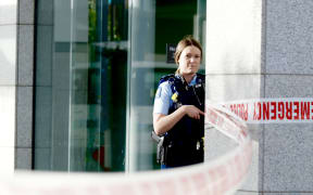 Police at the scene of a shooting incident in downtown Auckland on 20 July, 2023.