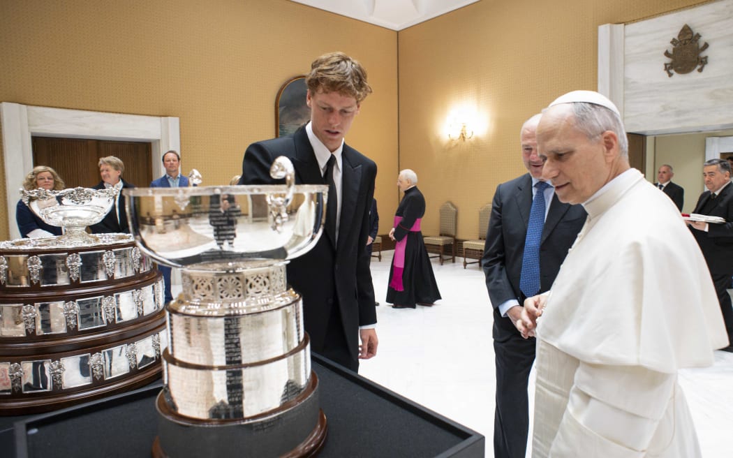 This photo taken and handout on May 14, 2025 by The Vatican Media shows Pope Leo XIV during a private audience with Italy's tennis player Jannik Sinner, in The Vatican. (Photo by Handout / VATICAN MEDIA / AFP) / RESTRICTED TO EDITORIAL USE - MANDATORY CREDIT "AFP PHOTO / VATICAN MEDIA" - NO MARKETING - NO ADVERTISING CAMPAIGNS - DISTRIBUTED AS A SERVICE TO CLIENTS