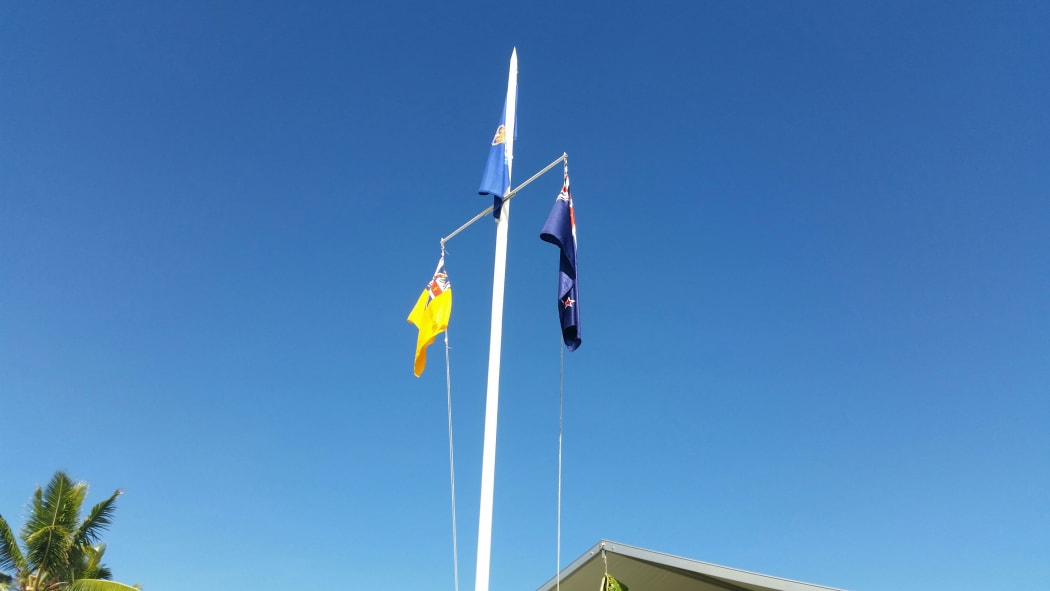 Niue and New Zea land flags raised outside the fono.