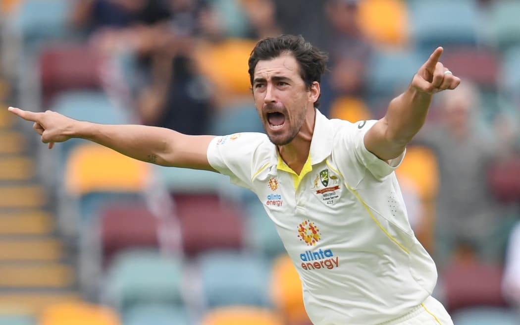 Mitchell Starc of Australia celebrates taking a wicket.