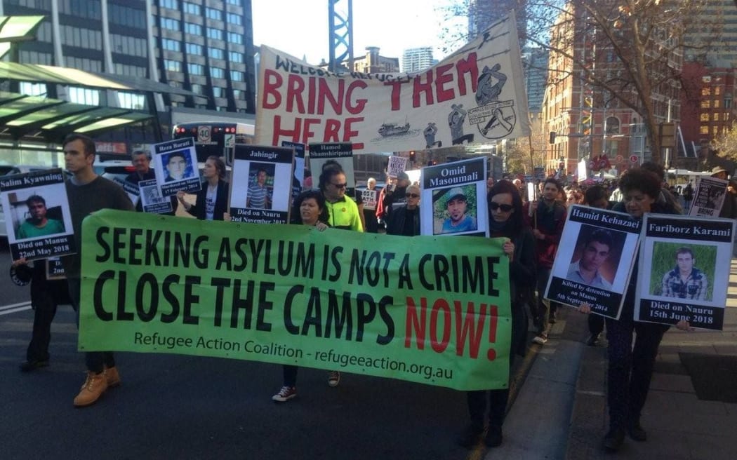 Protesters march in Australia, 21-7-18.