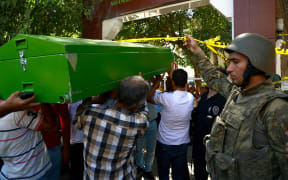 People carrying the coffin of one of the victim's of the bombing.