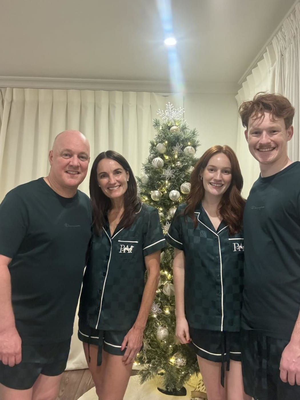 A photo shared by Christopher Luxon of himself, his wife Amanda, his daughter Olivia, and son William wearing matching pyjamas.