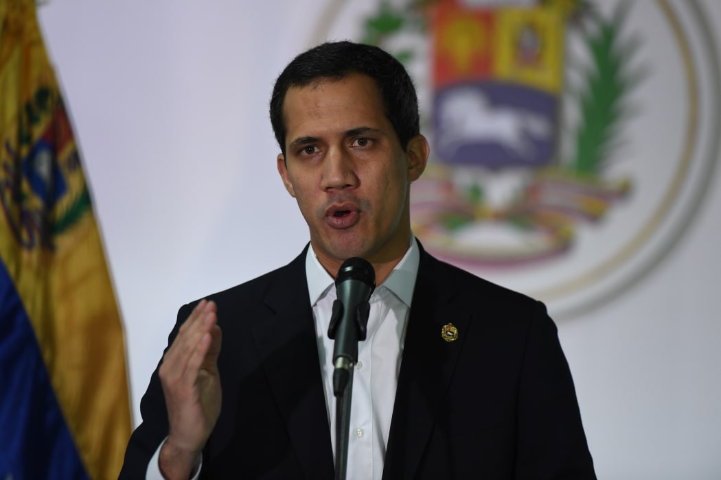 Venezuelan opposition leader and self-proclaimed acting president Juan Guaido speaks during a press conference in Caracas, on December 1, 2019.