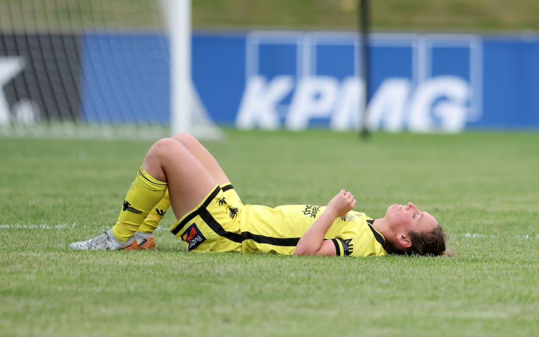 Phoenix captain Annalie Longo lays dejected after their loss during the A-League Women - Wellington Phoenix  FC v Canberra Utd football match.