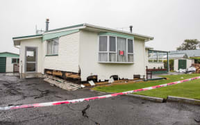 A red stickered house in Kaikōura