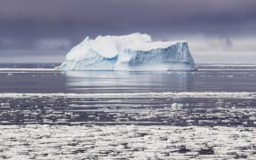 Iceberg in Antarctic winter and storm clouds at the background. (Photo by I. NOYAN YILMAZ/SCIENCE PHOTO LI / NYI / Science Photo Library via AFP)