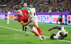 Wales player Josh Adams scores against Fiji.