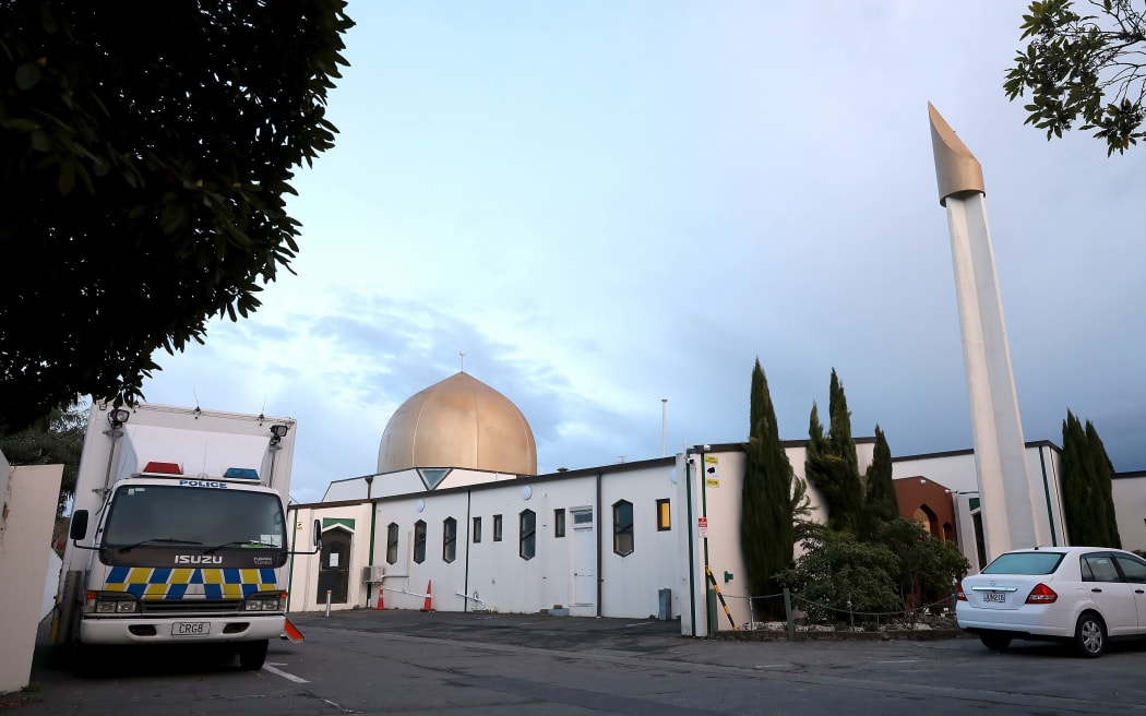 A police vehicle (L) is seen parked by the Al-Noor Mosque ahead of the last day of the sentencing hearing for Brenton Tarrant, the gunman who massacred 51 people during last year's twin mosque attacks, in Christchurch on August 27, 2020.