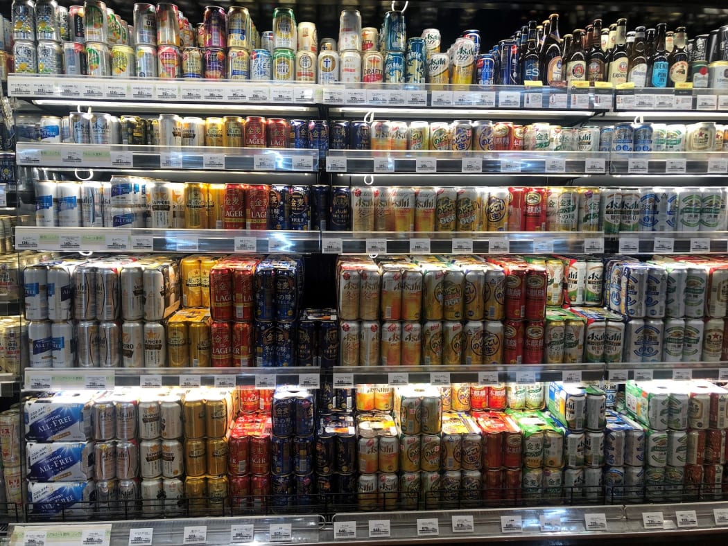 Motoko's local supermarket's liquor corner. Can you tell any difference? There is a mixture of beer, happoshu, third beer AND alcohol-free beer cans all in this photo.