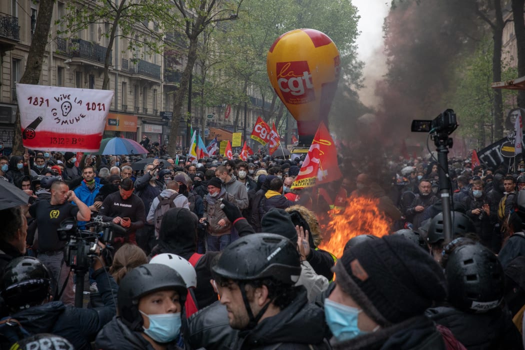 Protesters and police clashed at the beginning of a May Day march in Paris.