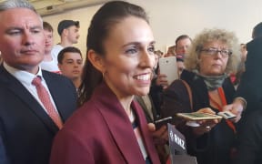 Jacinda Ardern (centre) and Labour deputy leader Kelvin Davis (left) speaking to the media after the rally.