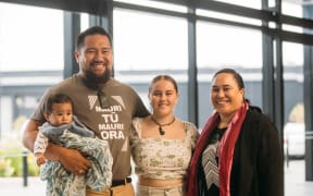 Michael Moka and his wife Tōria with their son Raukura O Te Huia, with the scholar they are supporting through First Foundation, Ella Harre.