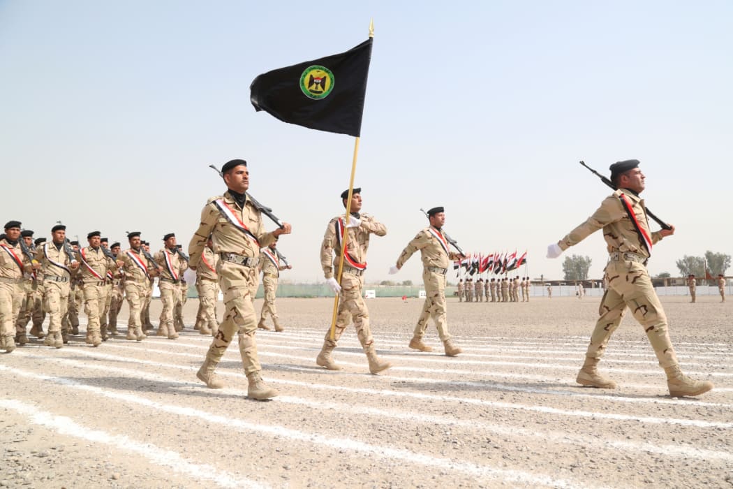 Iraqi Army soldiers march during the graduation ceremony of the Iraqi Army's Non- Commissioned Officers' Academy Junior Leaders Course at Taji Military Complex, Iraq.