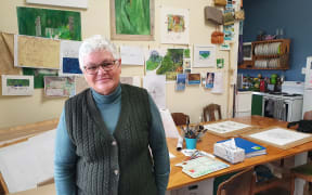 Writer, illustrator and historian Mere Whaanga in her Māhia studio