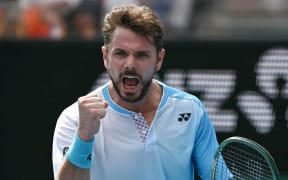 Switzerland’s Stan Wawrinka reacts after a point against Serbia’s Laslo Djere during their men's singles match on day two of the Australian Open tennis tournament in Melbourne on January 19, 2026. (Photo by WILLIAM WEST / AFP) / -- IMAGE RESTRICTED TO EDITORIAL USE - STRICTLY NO COMMERCIAL USE --
