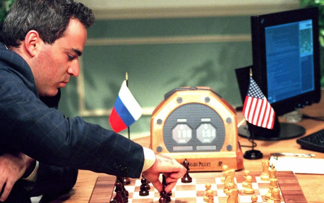 Gary Kasparov losing to IBM's Deep Blue computer in 1997