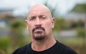 Billy Macfarlane stands outside Kohuora Auckland South Corrections Facility, a SERCO run high security men’s prison located at Wiri, in Auckland.