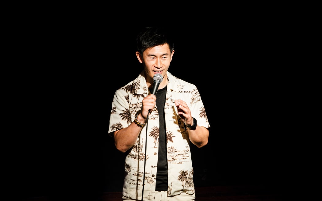 Takhou Law, a Kiwi Cantonese comedian born and raised in New Zealand.