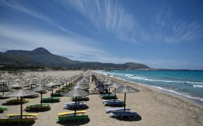 Tourists at Falassarna beach, Crete, on Saturday basked in the warmth, sun and crystal waters after Greece opened to tourists.