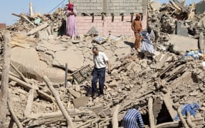 Villagers inspect the rubble of collapsed houses in Tafeghaghte, 60 kilometres southwest of Marrakesh, on 10 September, 2023, two days after a devastating 6.8-magnitude earthquake struck the country.