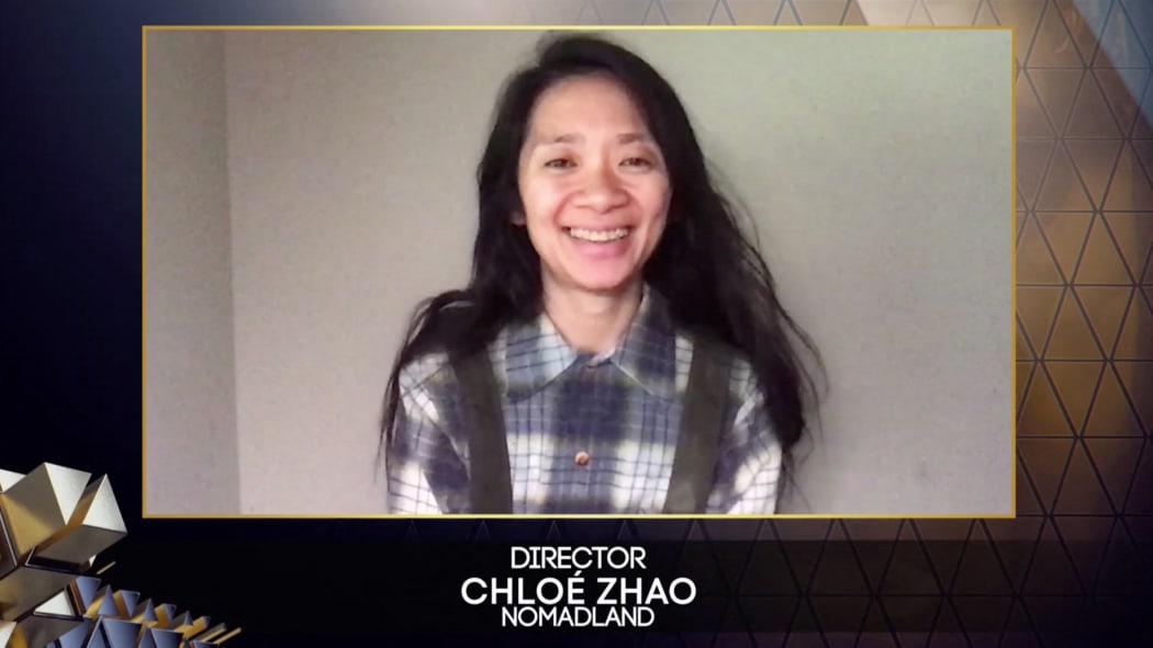 Chinese-born director Chloé Zhao reacting after winning best director for her work on the film 'Nomadland', via video link, at Britain's BAFTA awards, 11 April 2021. April 11, 2021.