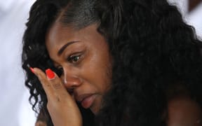 Myeshia Johnson wipes away tears during the burial service for her husband U.S. Army Sgt. La David Johnson at the Memorial Gardens East cemetery on October 21, 2017 in Hollywood, Florida.