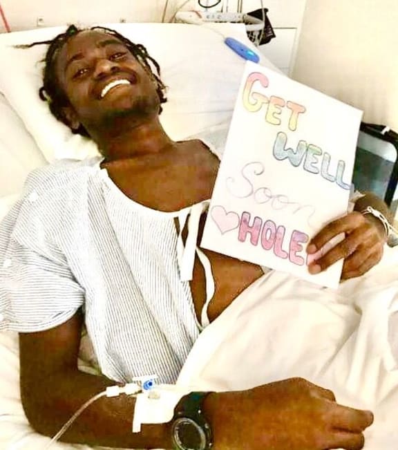 Hollingsword Wolul from his hospital bed