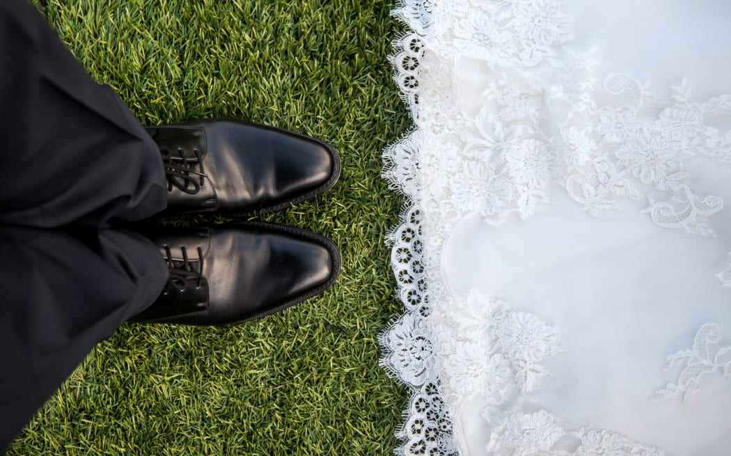 wedding mens shoes and edge of gown