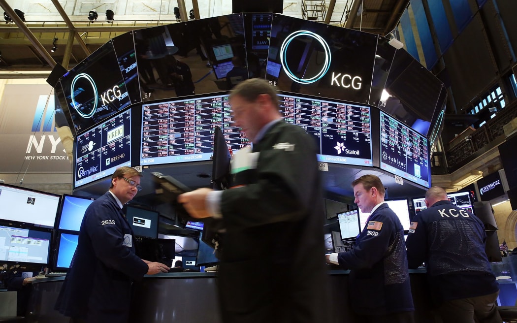 Traders work on the floor of the New York Stock Exchange