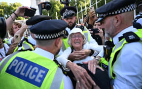Police in London arrest an 89-year-old protester at a "Lift The Ban" demonstration in support of the group Palestine Action.
