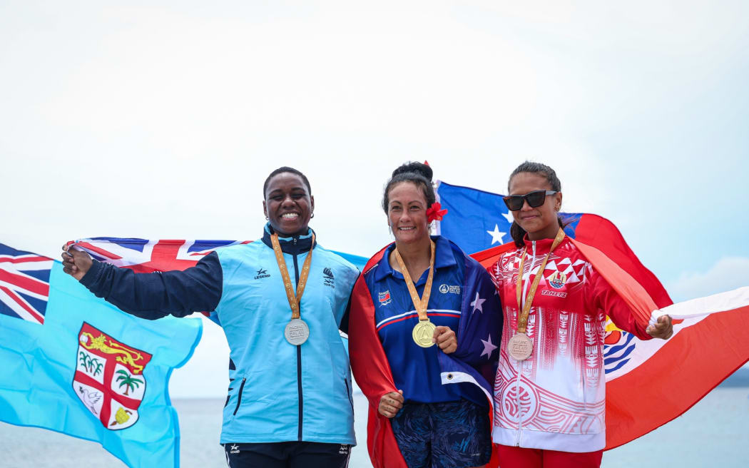The podium finishers in the female V1 500m va'a race from Fiji, Samoa, and Tahiti.