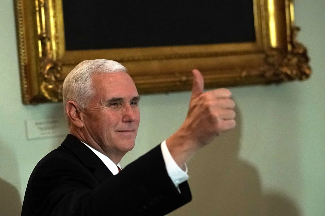 US Vice-President Mike Pence reacts to news sweeping tax reforms have been passed