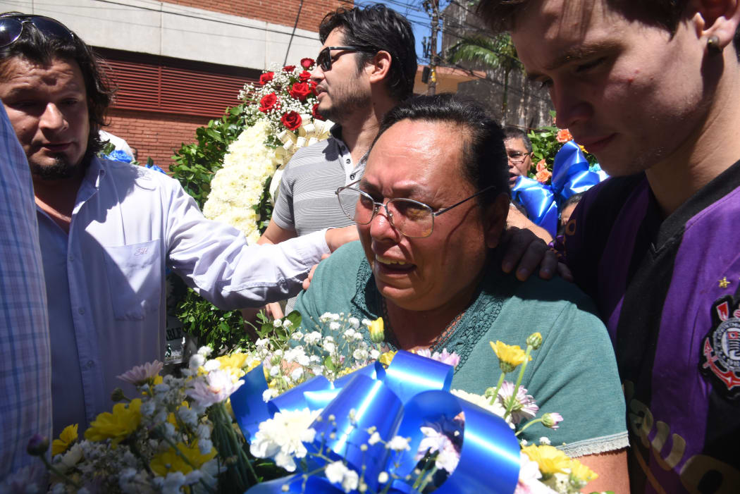 Felicita de Quintana, the mother of Rodrigo Quintana, 25, who was shot dead on the eve during a protest against the approval of a constitutional amendment for presidential reelection, mourns during his funeral in Asuncion.