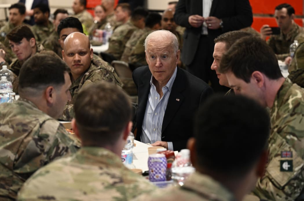 US President Joe Biden in Poland on Friday, talking with members of the US Army's 82nd Airborne Division, who are working alongside Polish allies on the Alliance's eastern flank, in the city of Rzeszow.