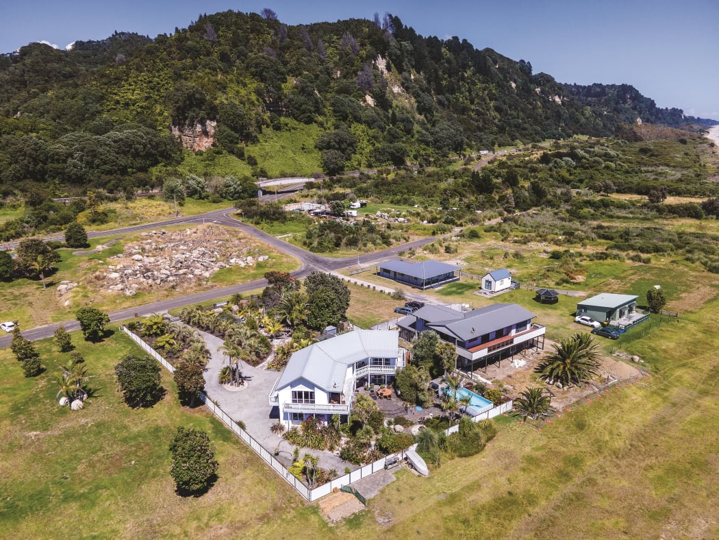 Several homes have already been removed from the Awatarariki fanhead. Rick and Rachel Whalley’s (front) will be the last to go.