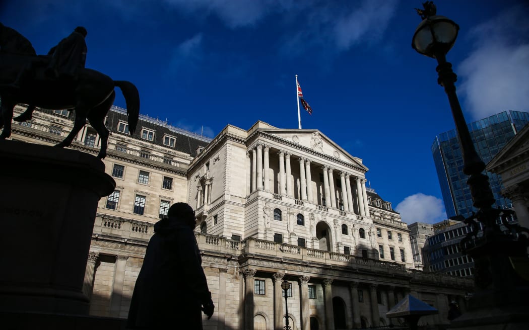 A man walks past the Bank of England in London, United Kingdom on November 3, 2022.