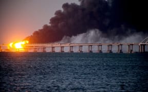 Russia says three people were killed in an explosion and fire on a strategic bridge over the Kerch Strait, on 8 October.
