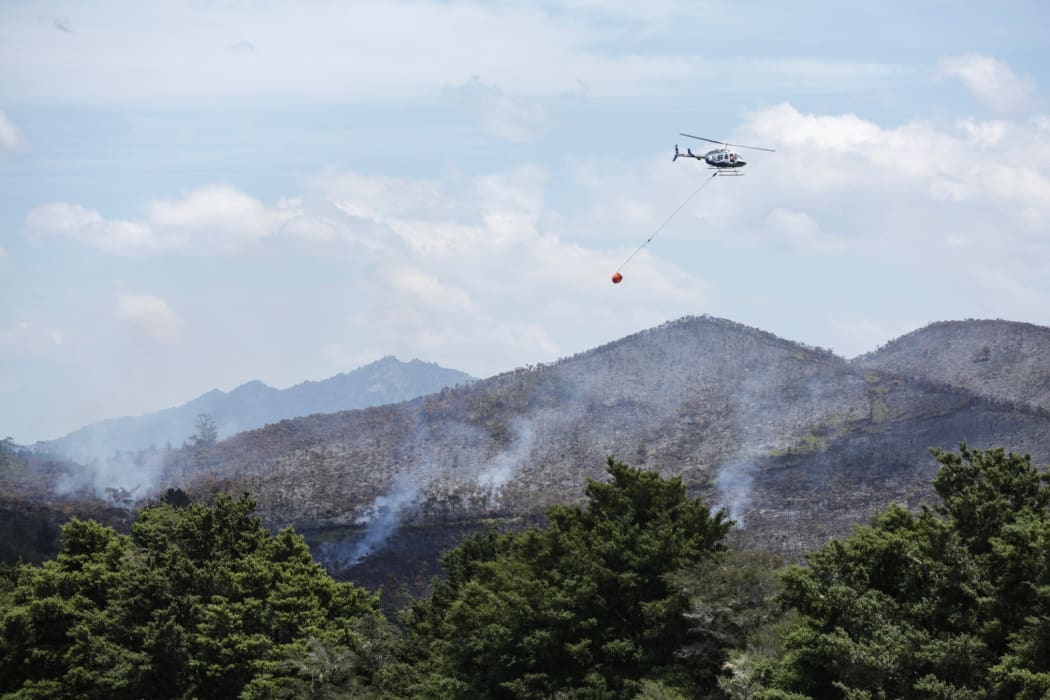 Helicopters douse a fire in Northland.