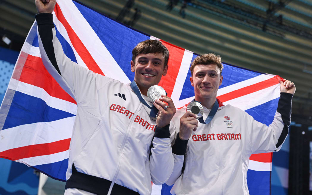 Britain's Tom Daley, left, and Noah Williams celebrate with their silver medals following the men's synchronised 10m platform diving at the Paris 2024 Olympic Games.