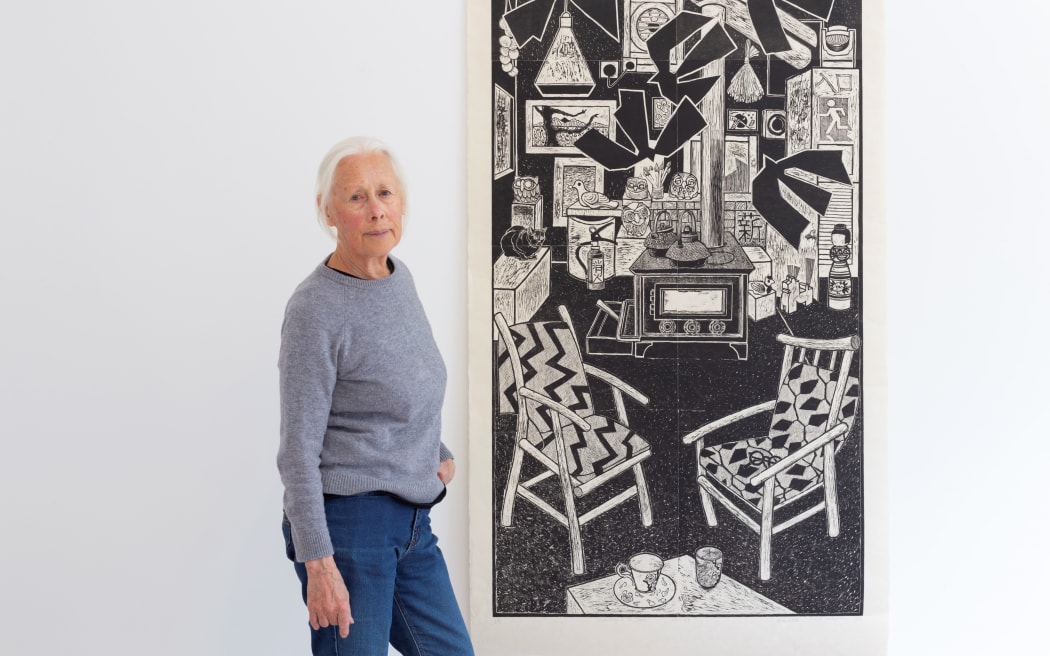 Robin White with her work ‘A meeting in the cosmos’ 2024 woodblock print on washi