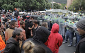 Protesters clashed with police during an early morning police operation at Parliament.