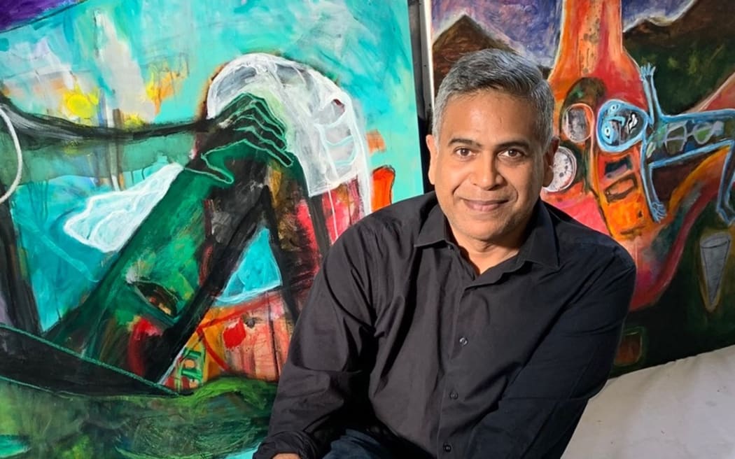 Mervin Singham with his art
