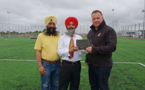 At Gurdwara Sri Kalgidhar Sahib Sikh Temple's new sports field, vice president Manjinder Singh, president Lali Ranvir Singh and TigerTurf's managing director Stephen Stones.