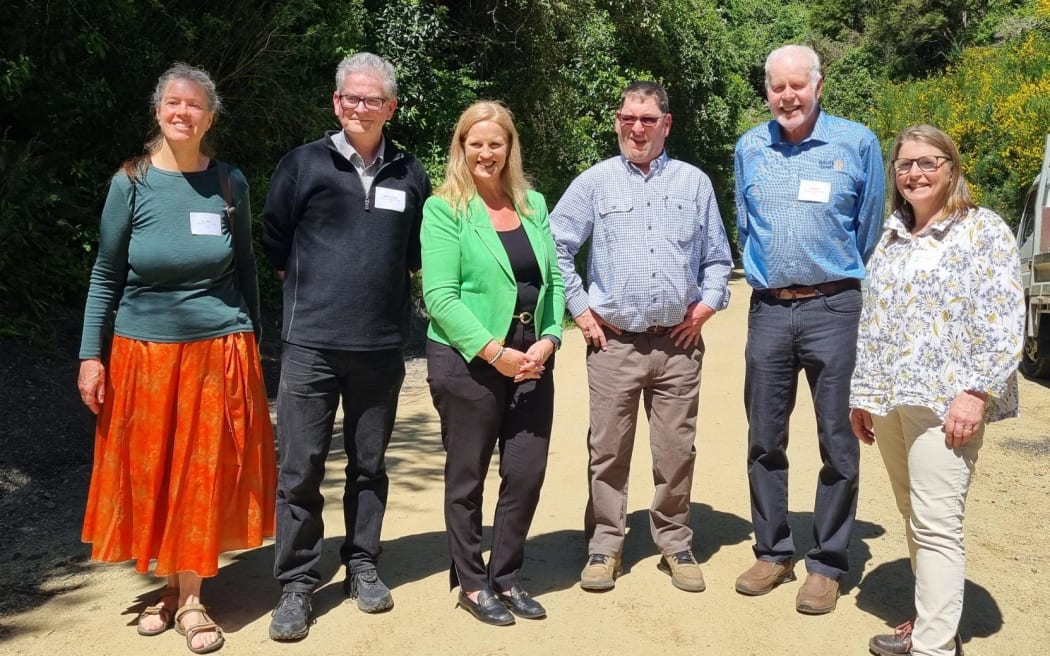 Dunedin Tunnels Trail Trust trustees, including Kate Wilson on the far right, with Minister Louise Upston.