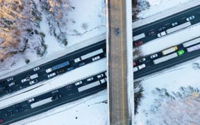 In an aerial view, traffic creeps along Virginia Highway 1 after being diverted away from I-95 after it was closed due to a winter storm on January 04, 2022