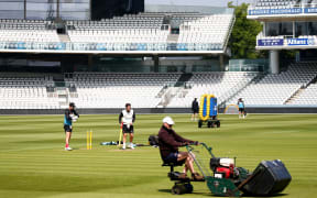 Wicketkeepers BJ Watling and Tom Blundell practice as groundstaff prepare the outfield at Lord's 2021.