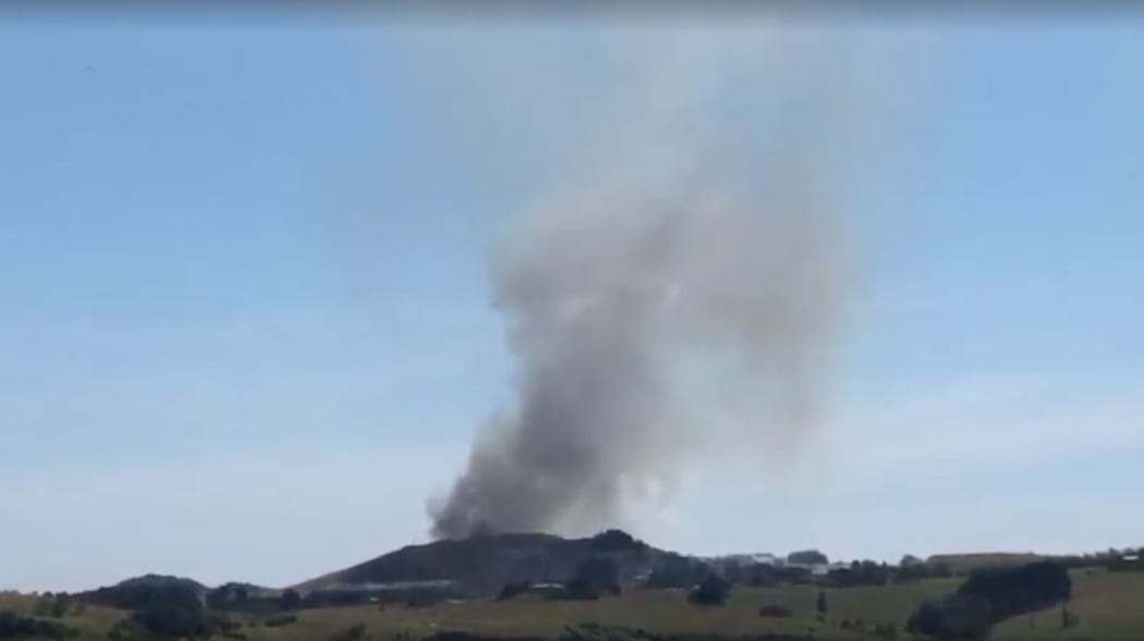Helicopters and two dozen firefighters battled the blaze at the Purewa landfill into the night.